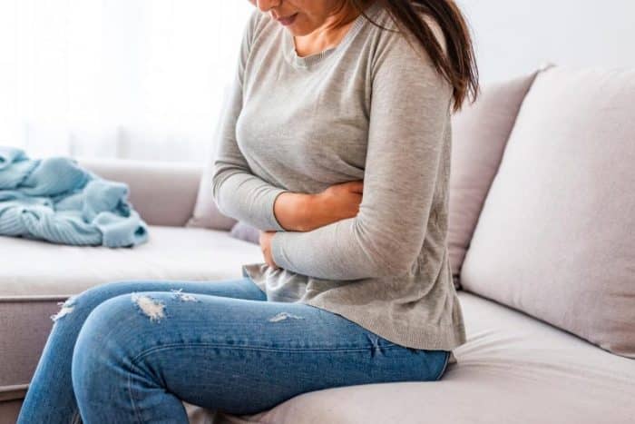 woman ibs stomach pain 777x518 1 e1640379555896